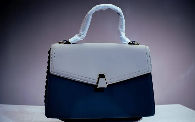 Victoria flap bag in Navy & ivory